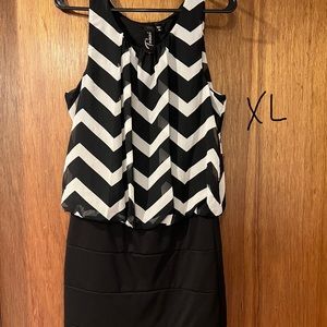 Black and white dress.  Probably fits more like a med/large